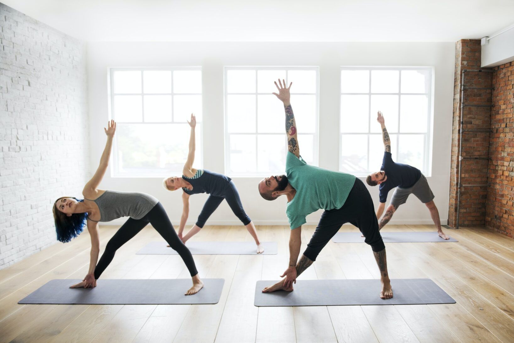 Group of diverse people are joining a yoga class